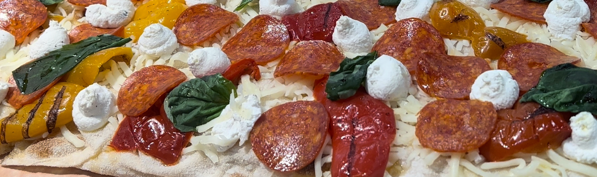 A picture of a mouth-watering pizza, still pre-baked but beautifully plated.